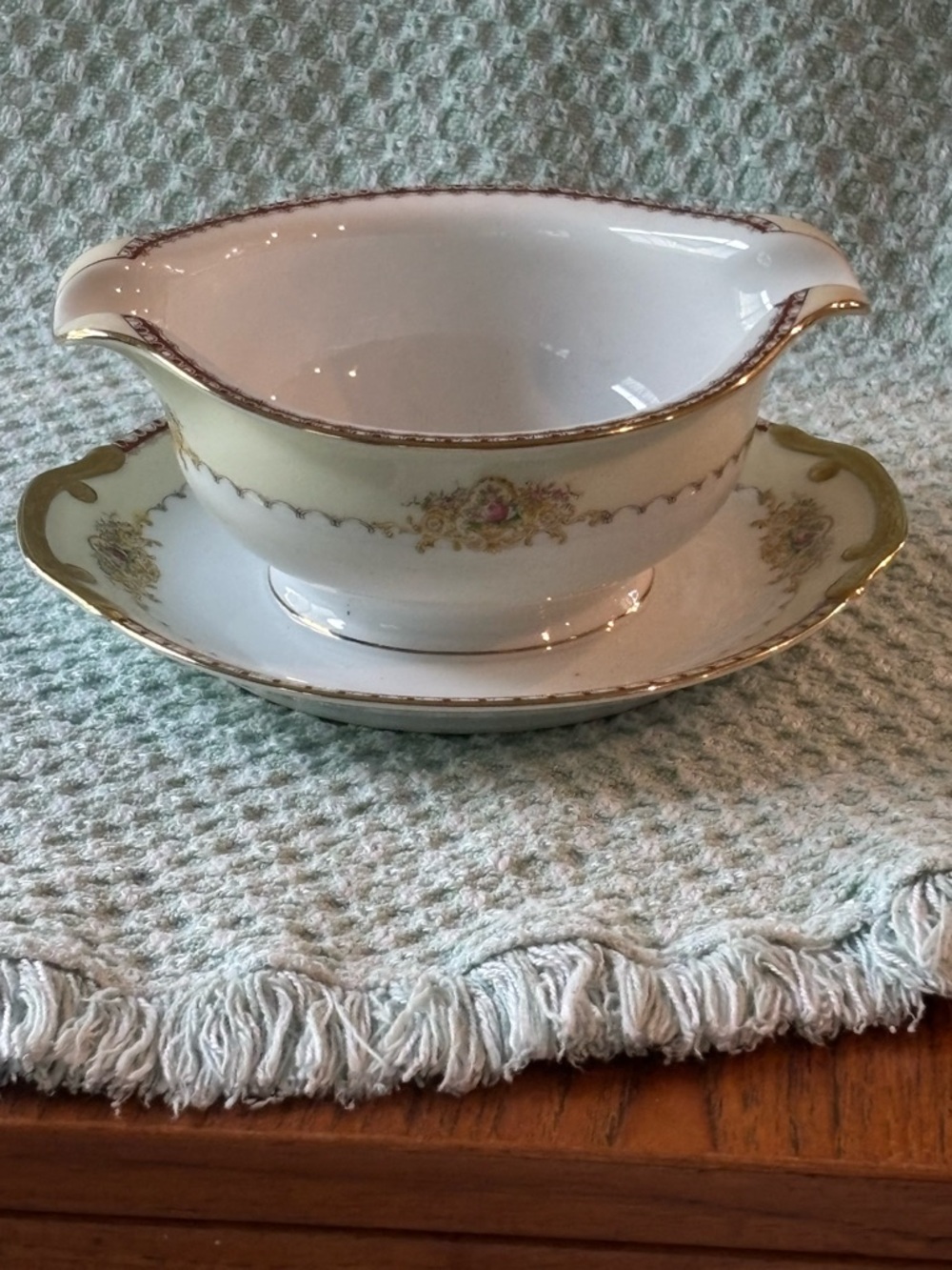 Meito China gravy boat with an attached underplate in the Dover pattern
